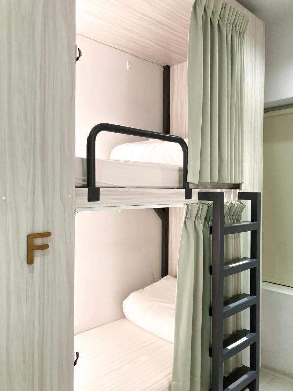 Postel nebo postele na pokoji v ubytování 4Plus Hostel