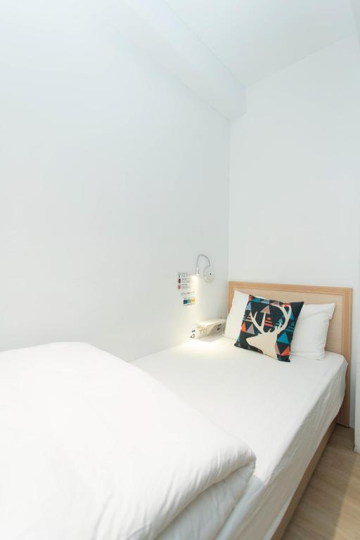 Postel nebo postele na pokoji v ubytování 4Plus Hostel