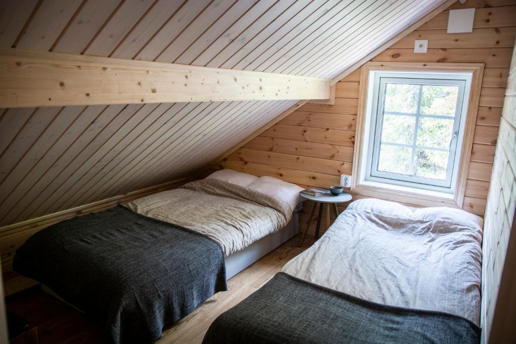 Postel nebo postele na pokoji v ubytování Kåvanstugan Funäsdalen