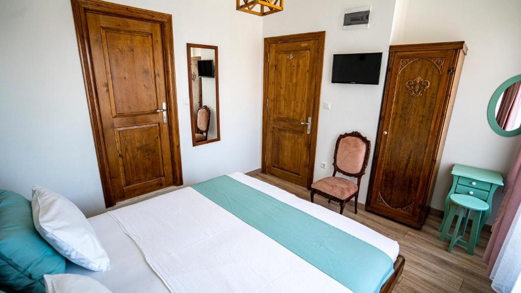 Postel nebo postele na pokoji v ubytování Ayışığı Hotel