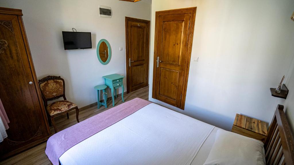 Postel nebo postele na pokoji v ubytování Ayışığı Hotel