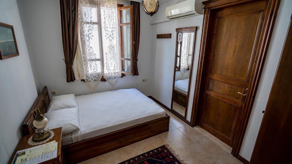Postel nebo postele na pokoji v ubytování Ayışığı Hotel