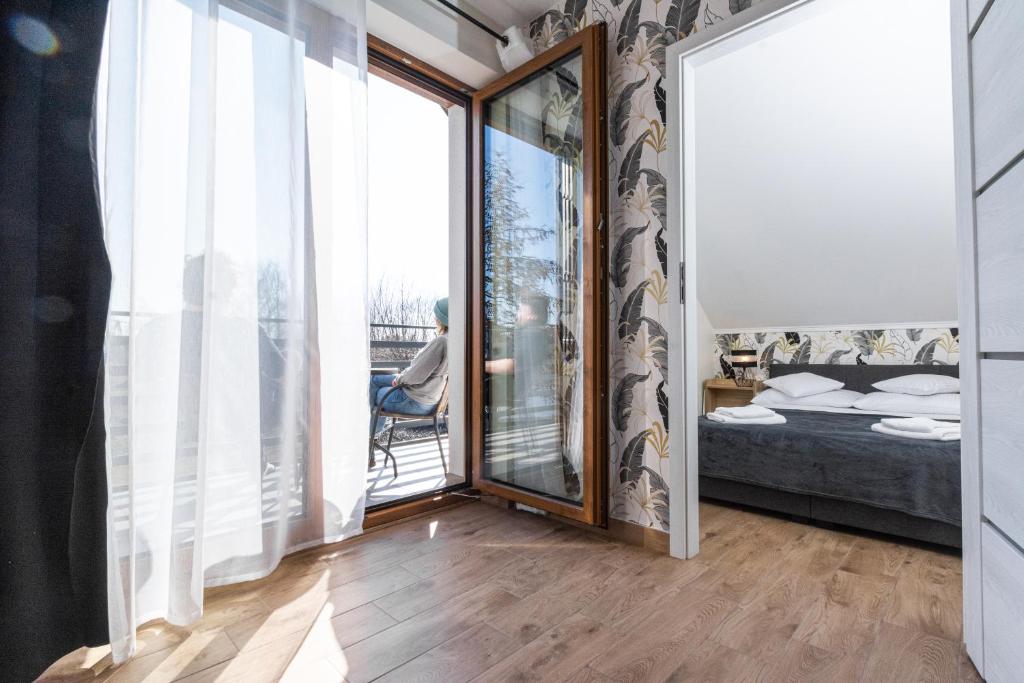 Posteľ alebo postele v izbe v ubytovaní Apartamenty Jantar