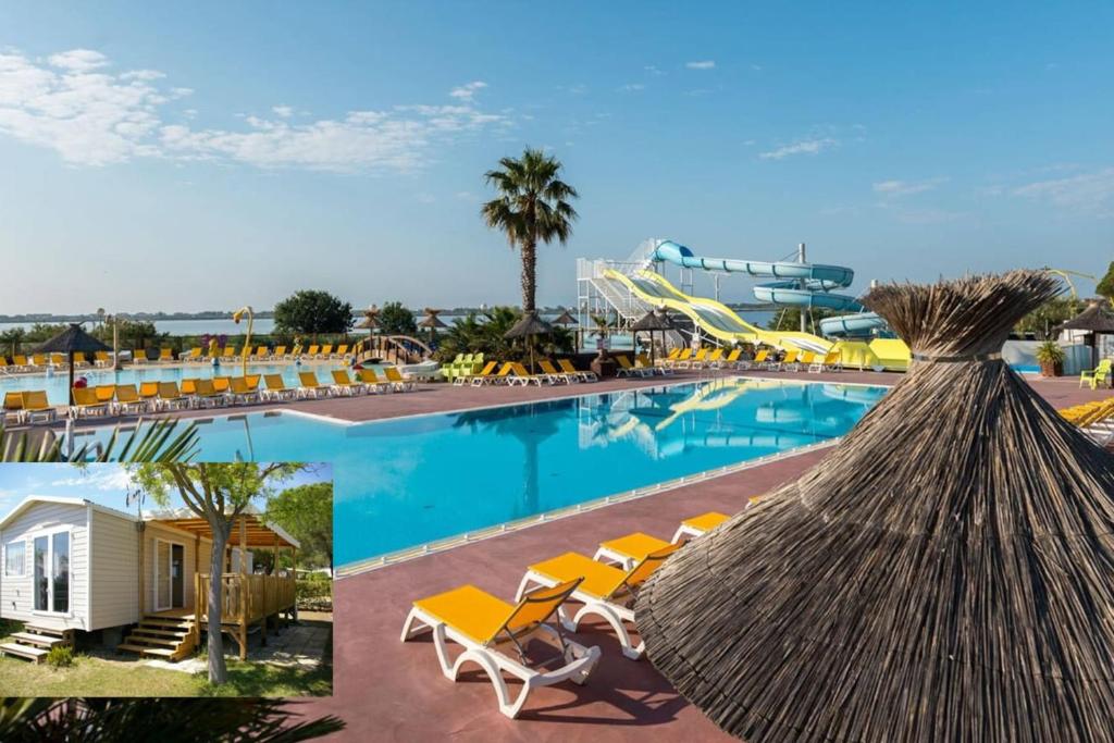 een zwembad in een resort met stoelen en een glijbaan bij Mobile Home OuiReves 304 facing the Mediterranean in Lattes