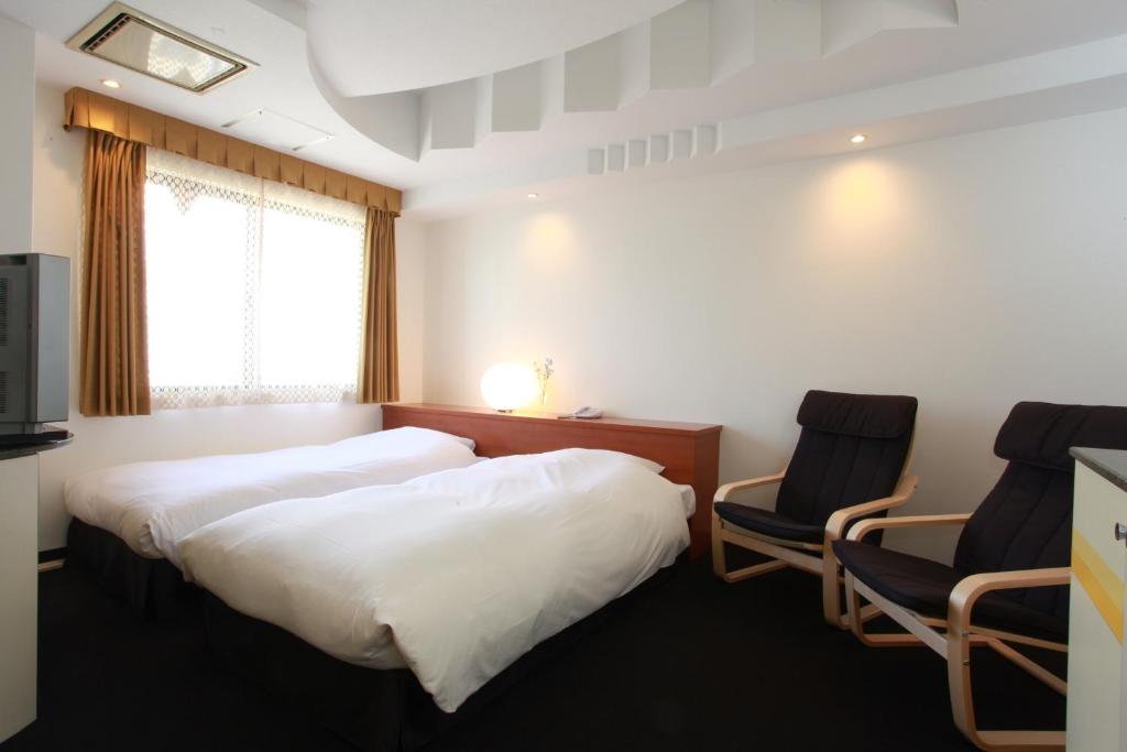 Postel nebo postele na pokoji v ubytování Hotel In Kyoto Sasarindou