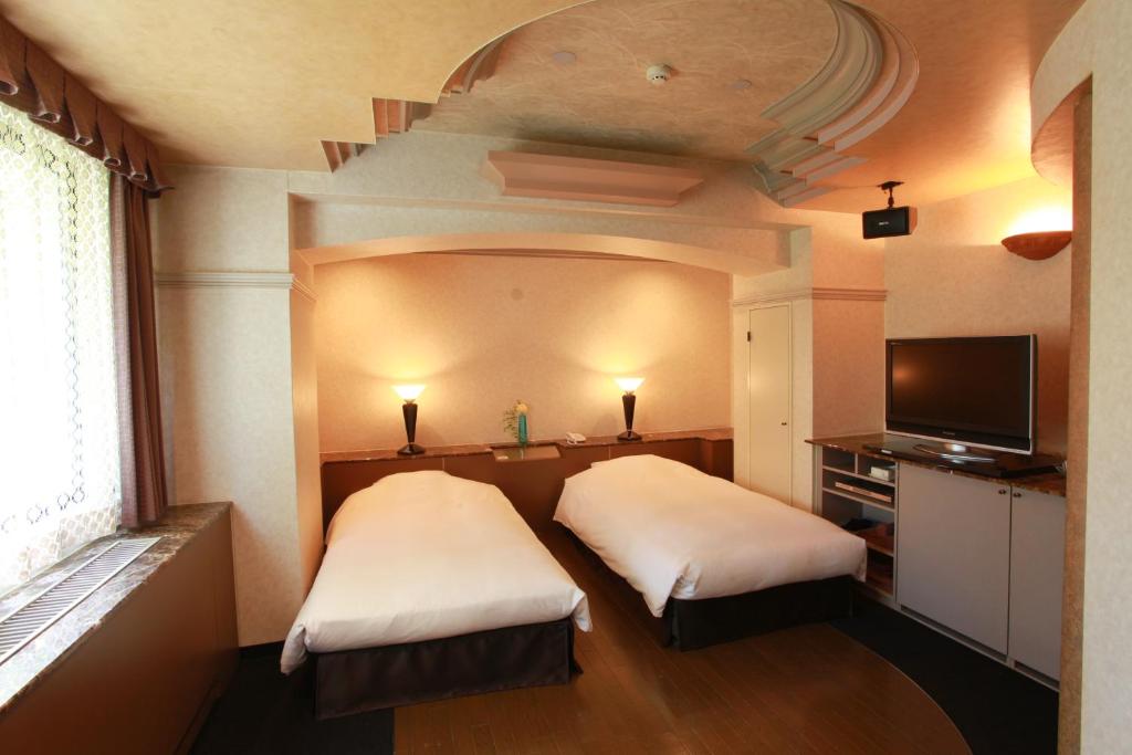Postel nebo postele na pokoji v ubytování Hotel In Kyoto Sasarindou
