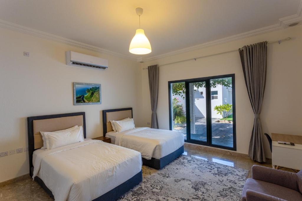 Postel nebo postele na pokoji v ubytování THE POOL VILLA - TANUF