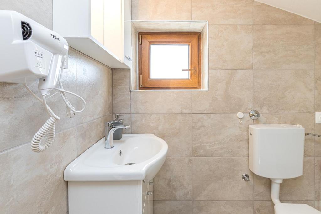 Koupelna v ubytování Apartment Slavko Cancini
