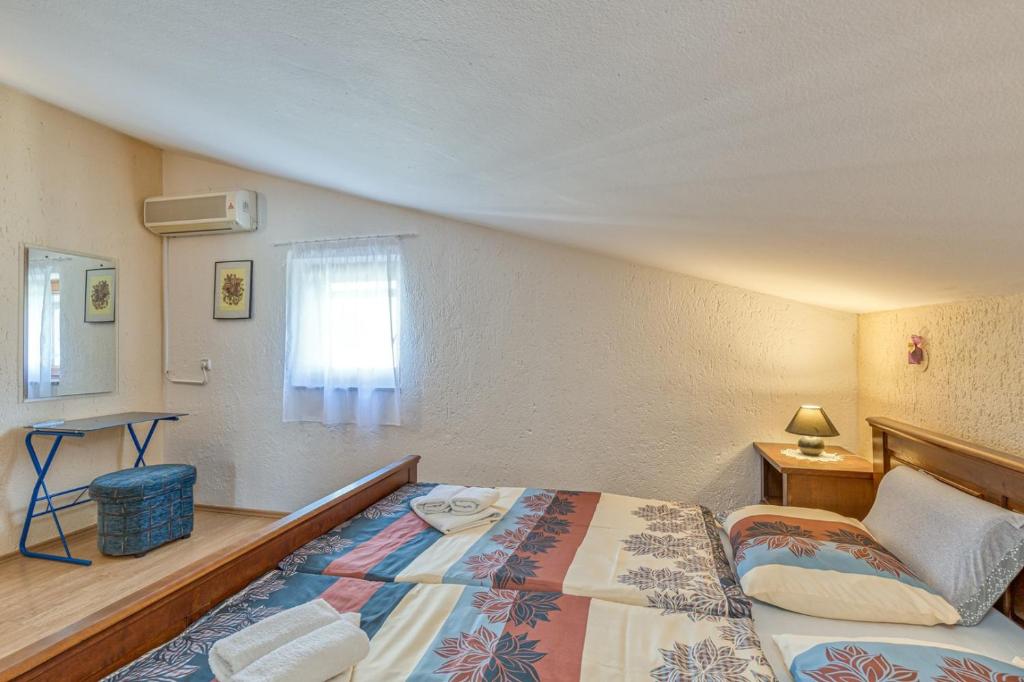 Postel nebo postele na pokoji v ubytování Apartment Slavko Cancini