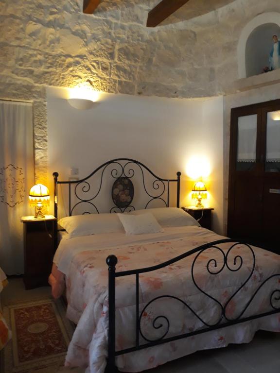 Postel nebo postele na pokoji v ubytování B&B Salita Delle Pere
