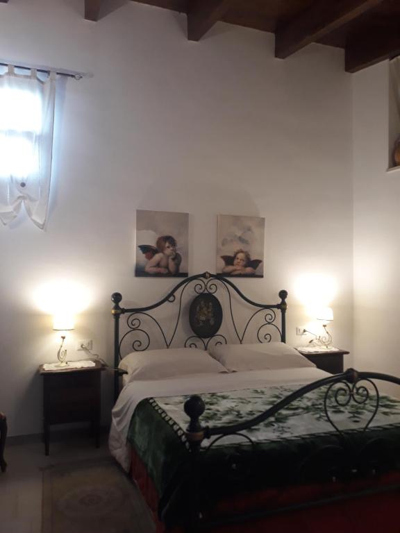 Postel nebo postele na pokoji v ubytování B&B Salita Delle Pere