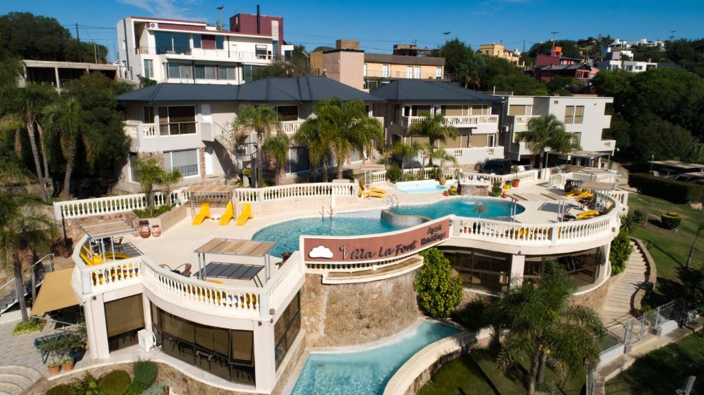 an aerial view of a resort with a swimming pool at Villa La Font Apart Hotel & Spa in Villa Carlos Paz