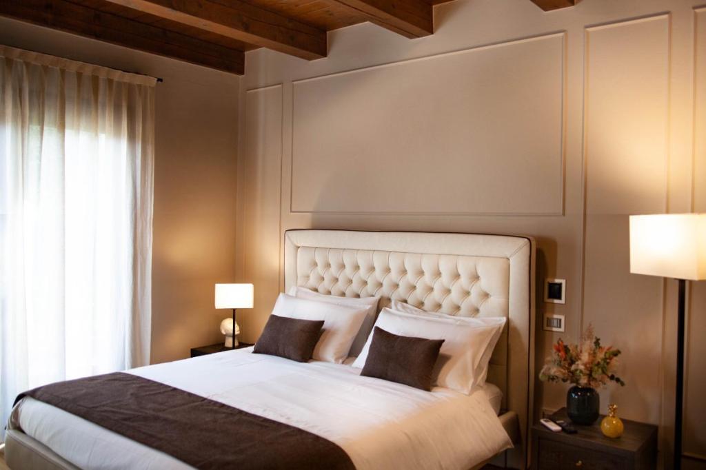 Posteľ alebo postele v izbe v ubytovaní Resort Villa Paola