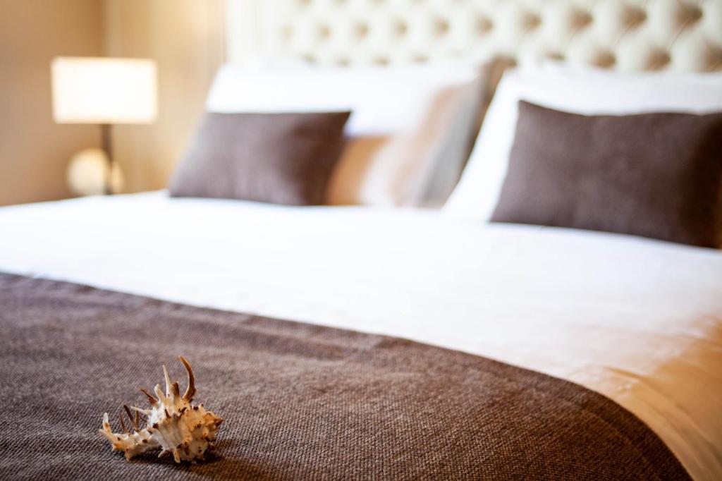 Posteľ alebo postele v izbe v ubytovaní Resort Villa Paola