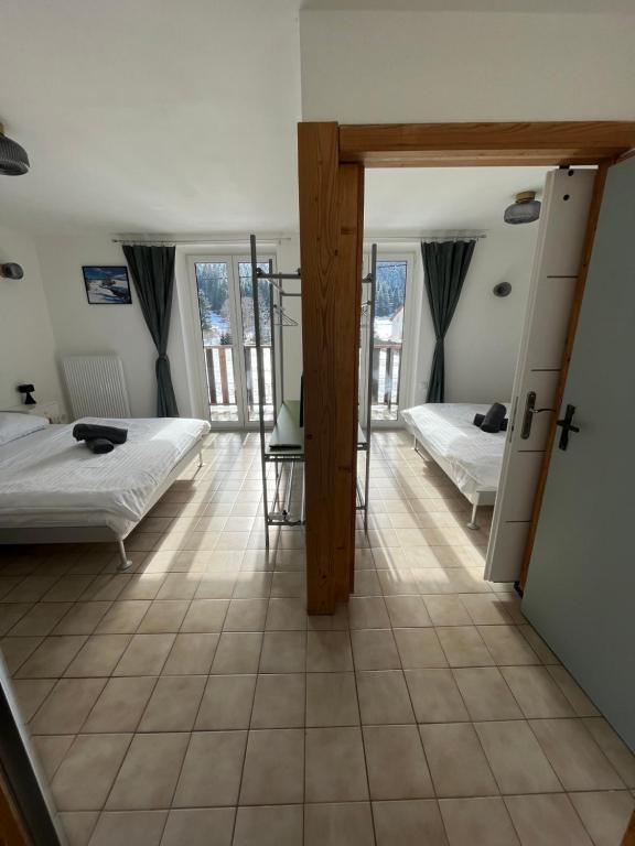 Postel nebo postele na pokoji v ubytování Horský penzion a bistro Čepice