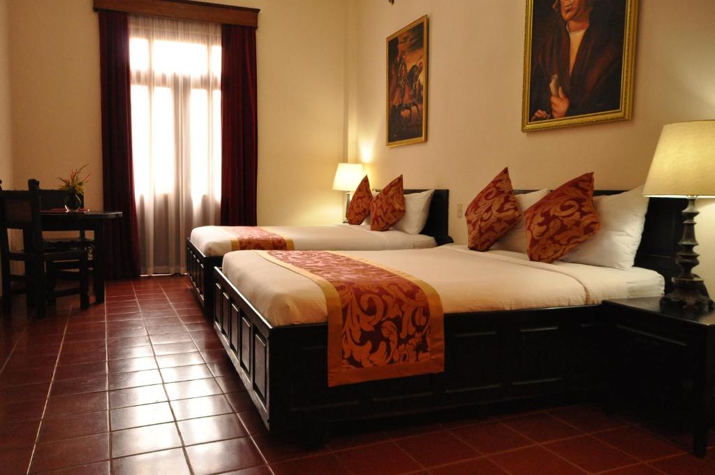 Postel nebo postele na pokoji v ubytování Boutique Hotel Palacio