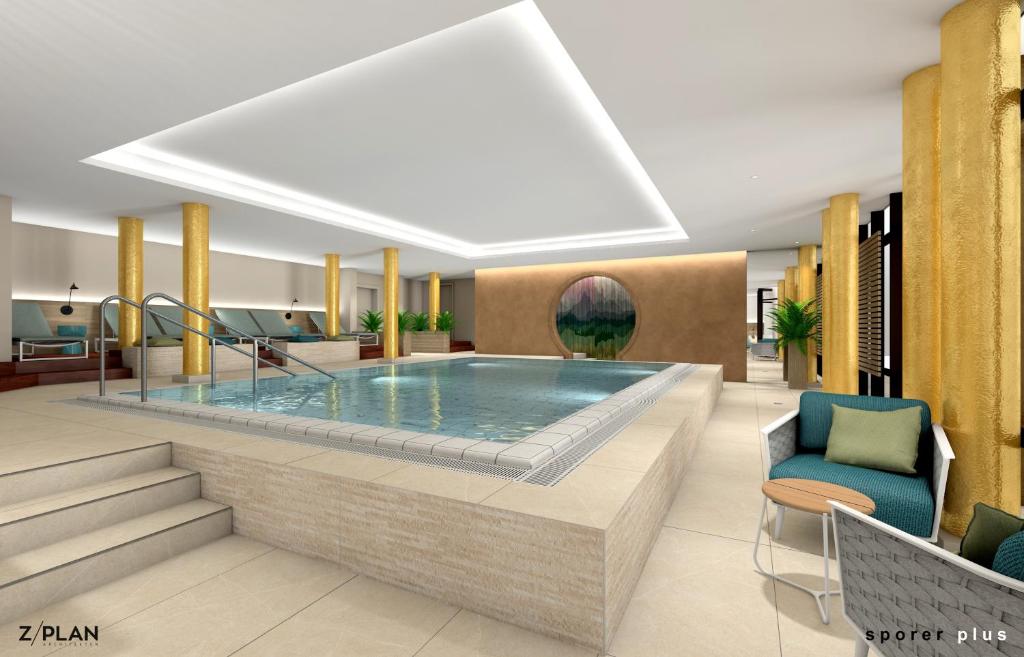 a rendering of a pool in a hotel lobby at AMBER HOTEL Bavaria in Bad Reichenhall