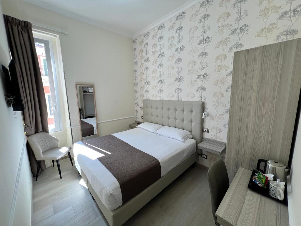 Una cama o camas en una habitación de Hotel Le Petit