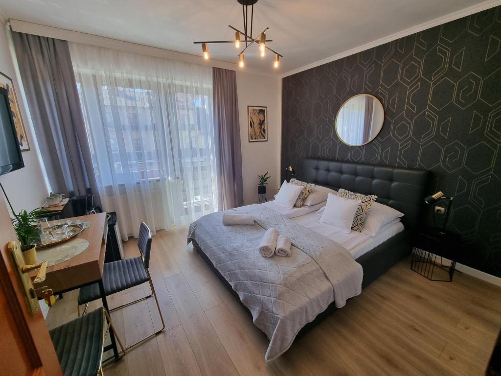 Postel nebo postele na pokoji v ubytování Pokoje U Mateusza