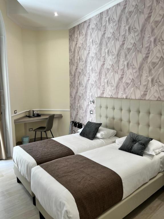 Una cama o camas en una habitación de Hotel Le Petit