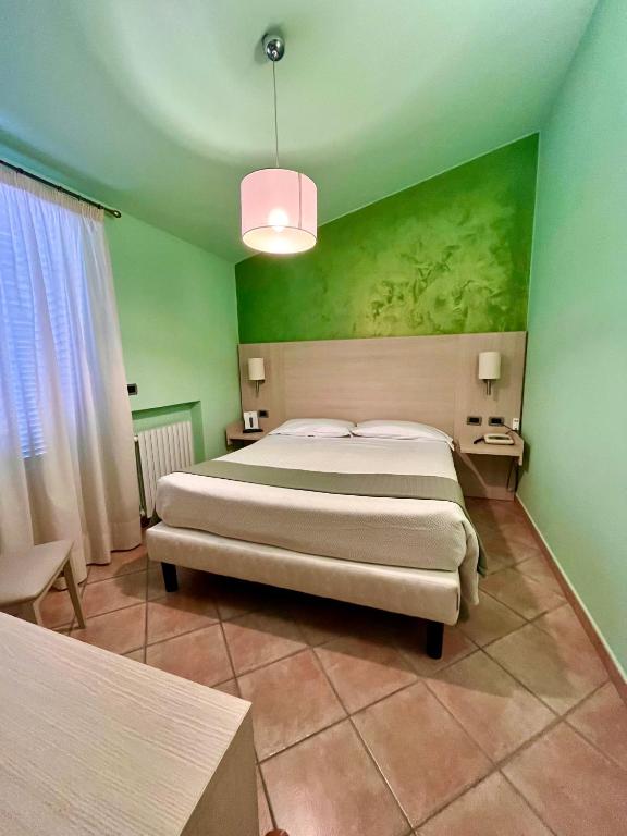 Postel nebo postele na pokoji v ubytování Albergo Africa