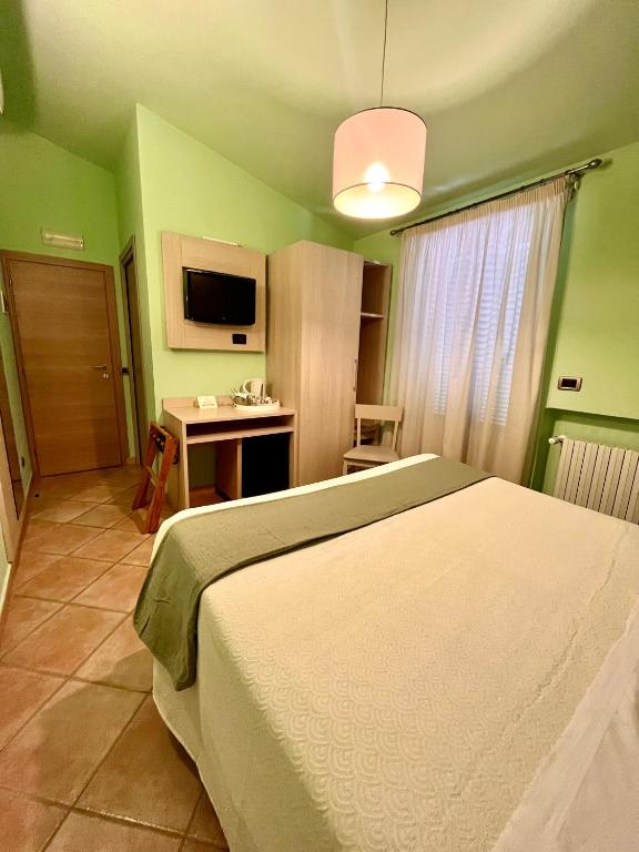 TV a/nebo společenská místnost v ubytování Albergo Africa