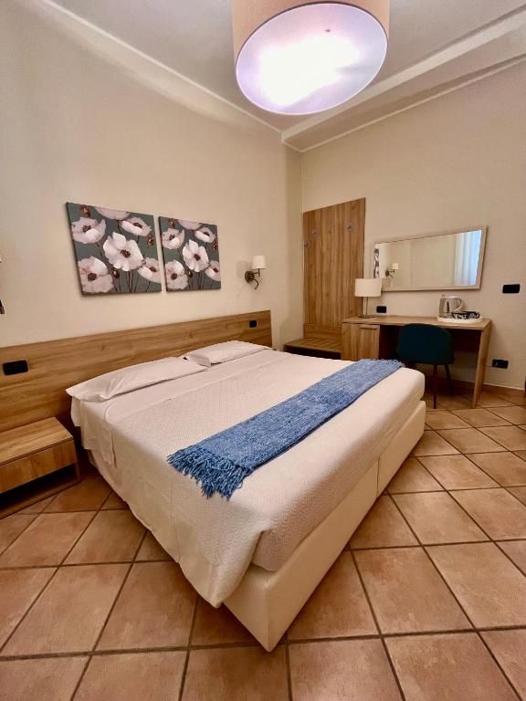 Postel nebo postele na pokoji v ubytování Albergo Africa