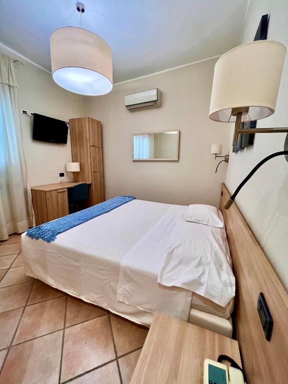 Postel nebo postele na pokoji v ubytování Albergo Africa
