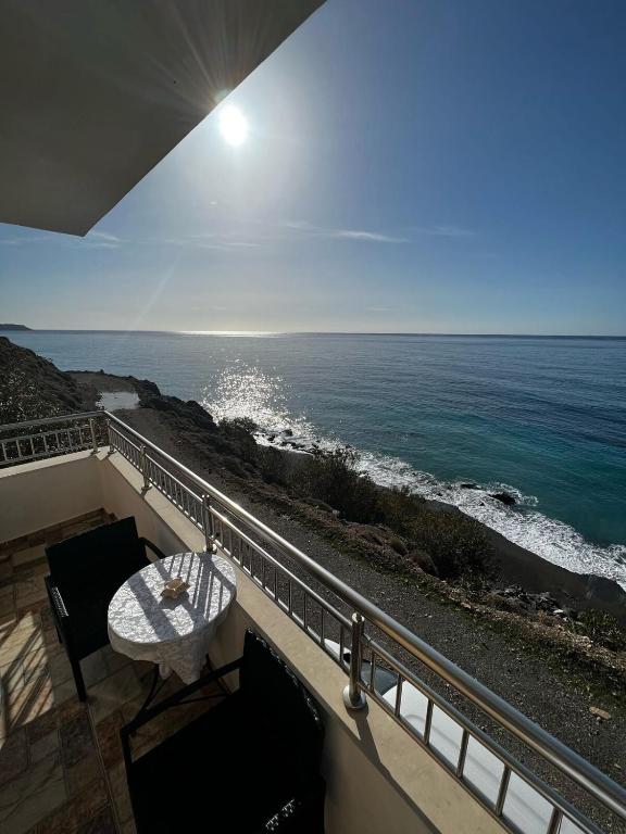 a view of the ocean from the balcony of a house at House With View in Paránimfoi