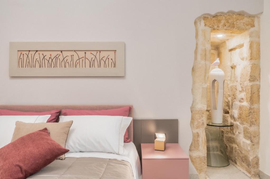Postel nebo postele na pokoji v ubytování Michelangelo B&B
