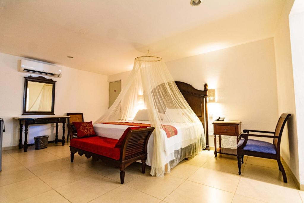 Postel nebo postele na pokoji v ubytování Hotel María Jose