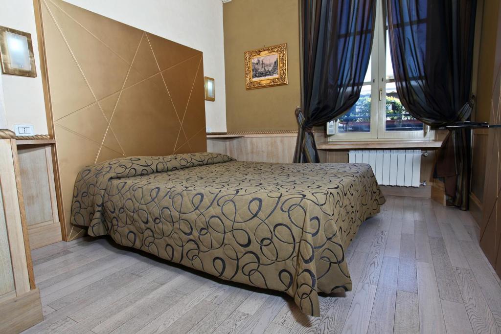 Postel nebo postele na pokoji v ubytování Hotel Nardizzi Americana