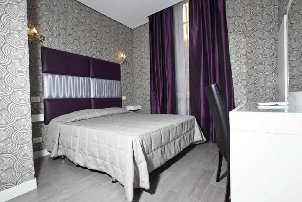 Postel nebo postele na pokoji v ubytování Hotel Nardizzi Americana