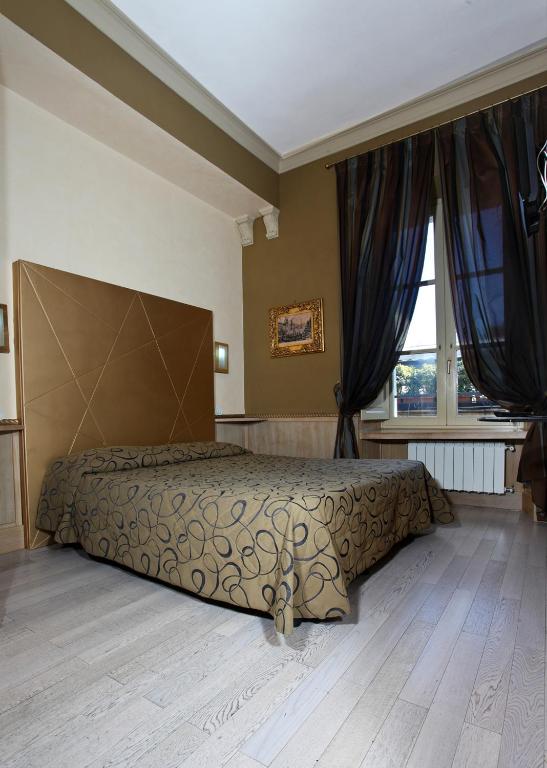 Postel nebo postele na pokoji v ubytování Hotel Nardizzi Americana
