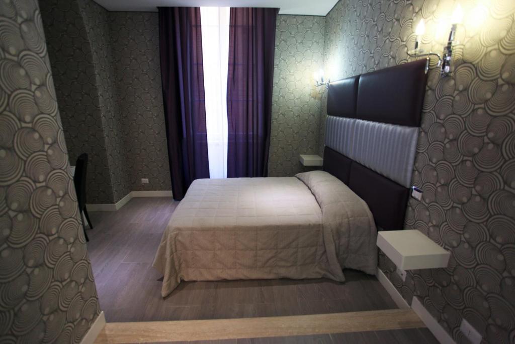 Postel nebo postele na pokoji v ubytování Hotel Nardizzi Americana