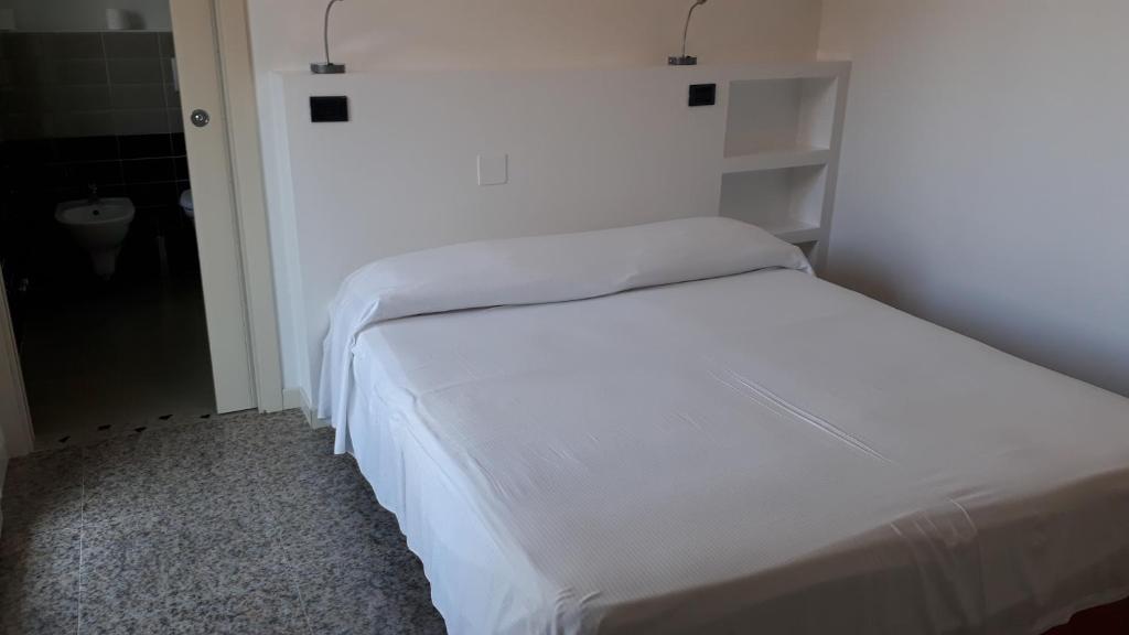 Postel nebo postele na pokoji v ubytování Hotel Marbella