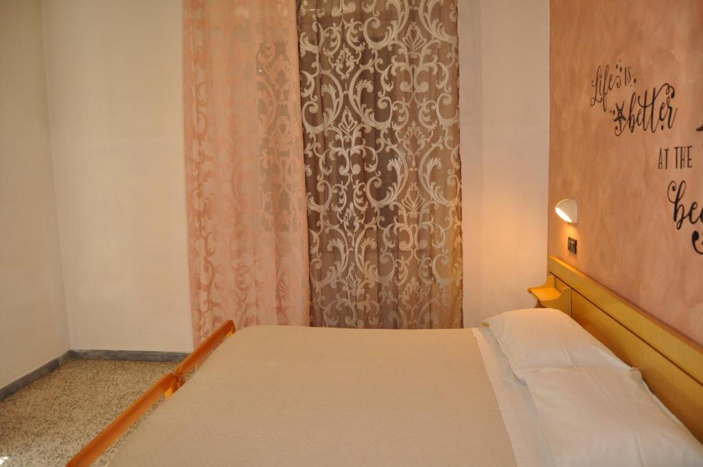Postel nebo postele na pokoji v ubytování Hotel Rigobello