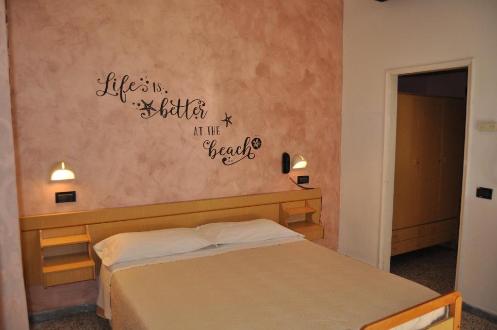 Postel nebo postele na pokoji v ubytování Hotel Rigobello