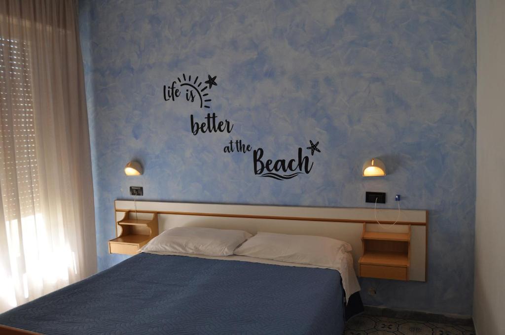 Postel nebo postele na pokoji v ubytování Hotel Rigobello