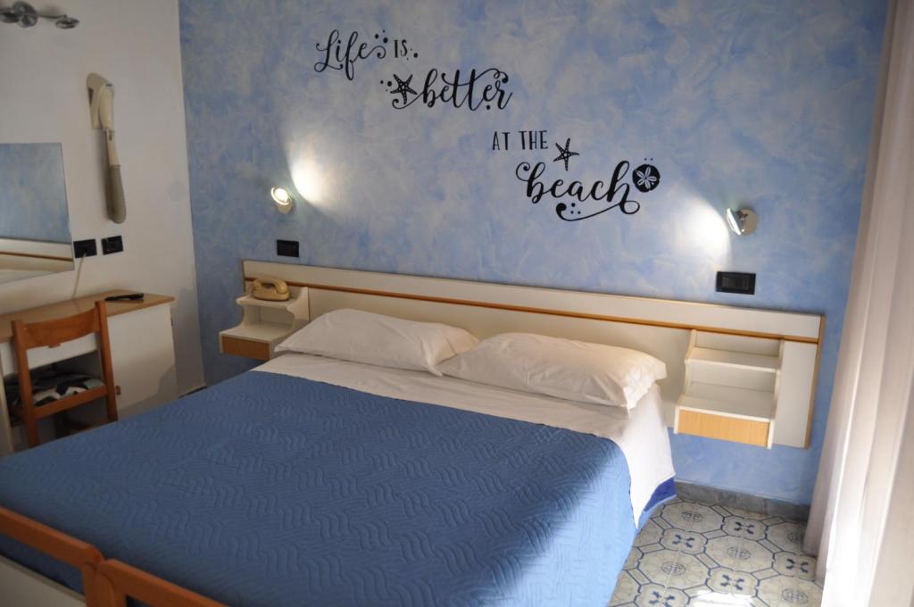 Postel nebo postele na pokoji v ubytování Hotel Rigobello