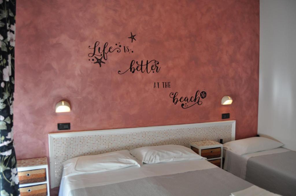 Postel nebo postele na pokoji v ubytování Hotel Rigobello