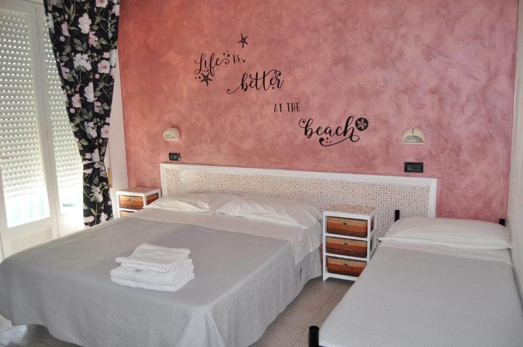 Postel nebo postele na pokoji v ubytování Hotel Rigobello