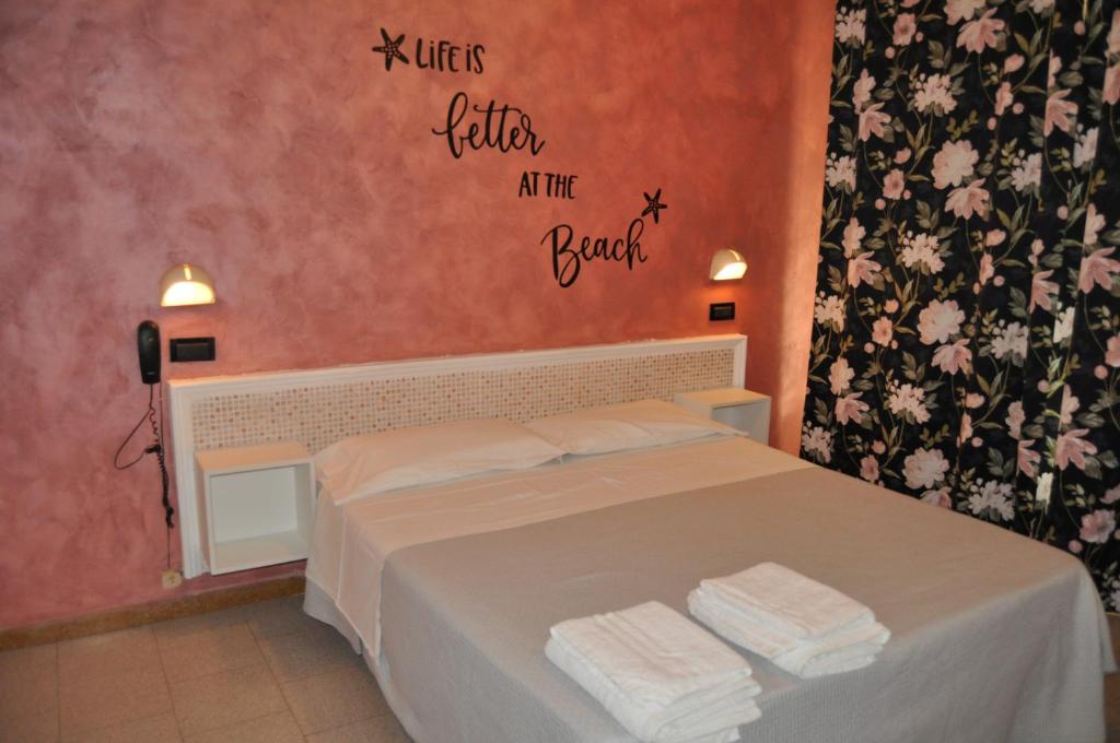 Postel nebo postele na pokoji v ubytování Hotel Rigobello