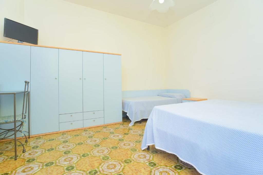 Una cama o camas en una habitación de Hotel Celeste