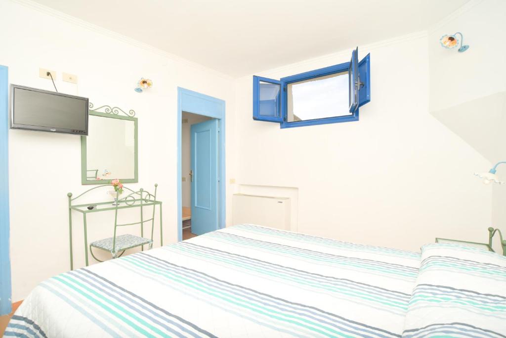 Una cama o camas en una habitación de Hotel Celeste