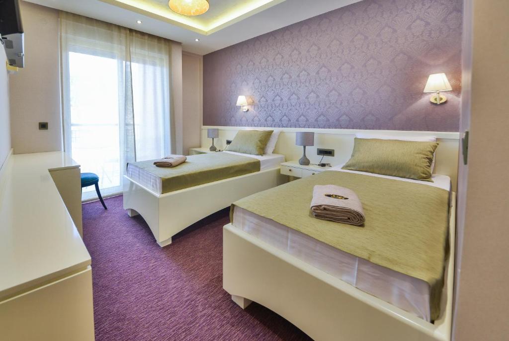 Postel nebo postele na pokoji v ubytování Villa Katarina