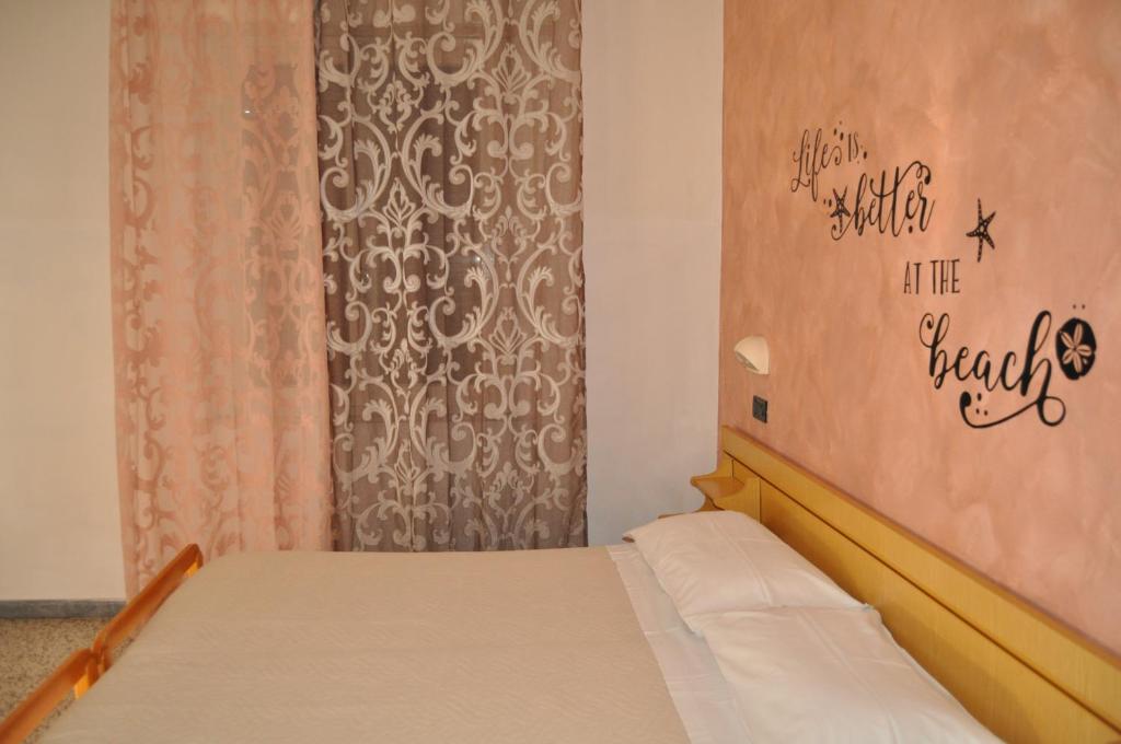 Postel nebo postele na pokoji v ubytování Hotel Rigobello