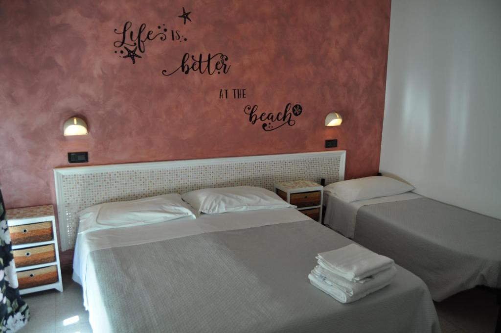 Postel nebo postele na pokoji v ubytování Hotel Rigobello