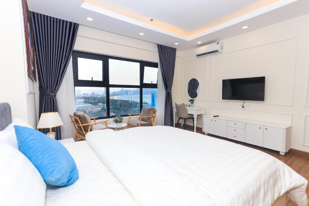 Postel nebo postele na pokoji v ubytování FLC Sea Tower - Căn Hộ Biển Quy Nhơn