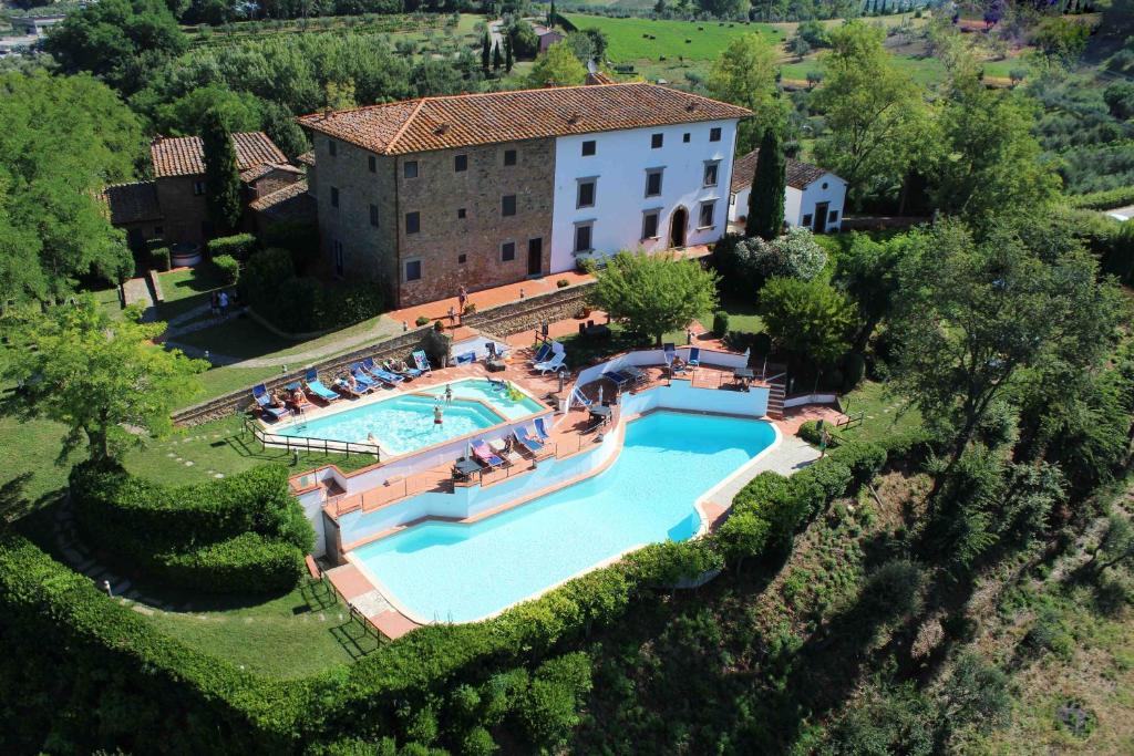 an aerial view of a house with a swimming pool at Borgo La Casaccia in Montaione